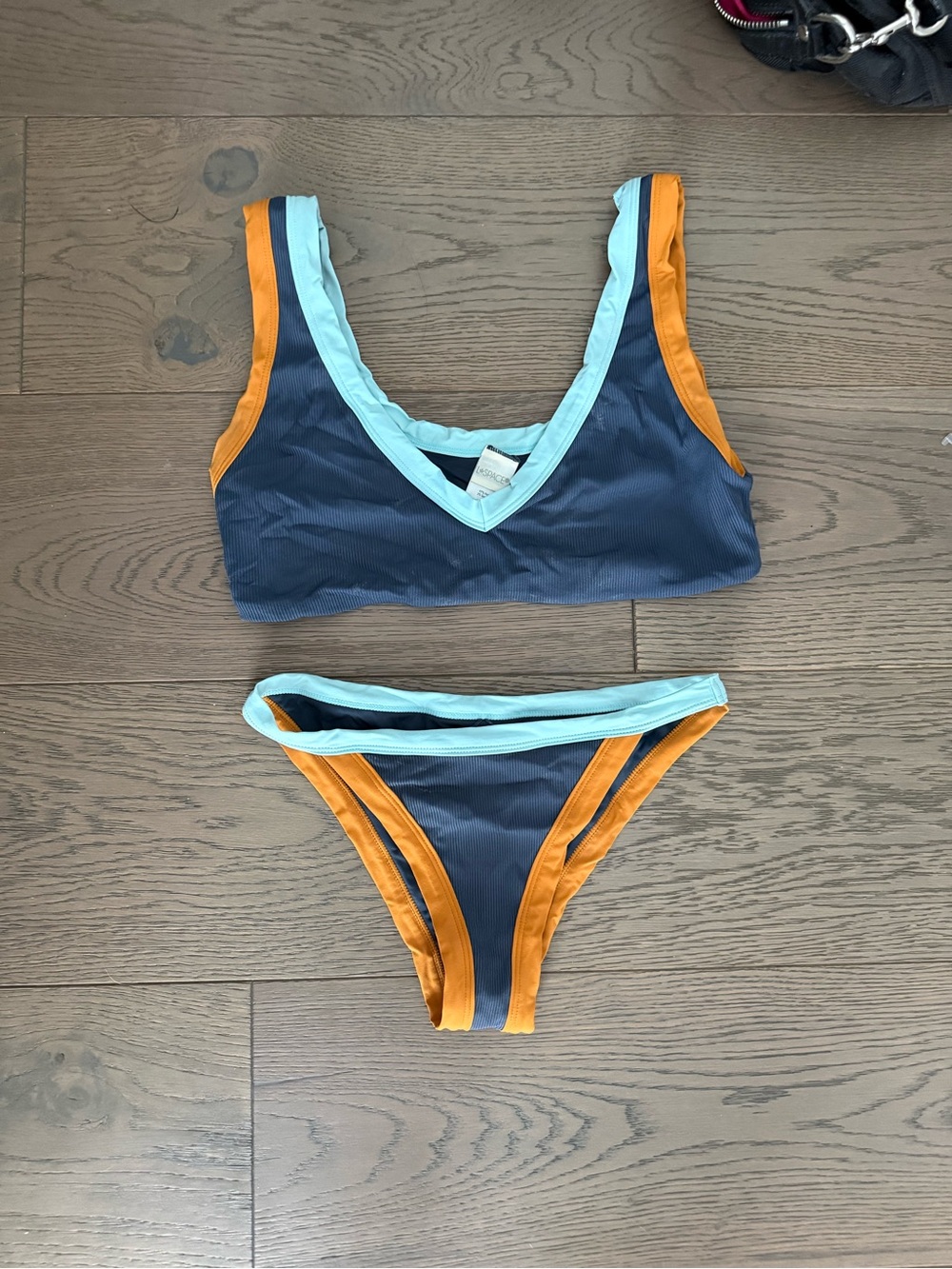 Women’s L-space Navy Blue Swim Set with Light Blue and Orange Trim. Size S/L